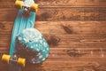 Skateboard flat lay on wooden floor