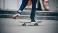 Skateboard man in shoes and jeans getting ready to jump kickflip olli from steps. Blurred background in motion