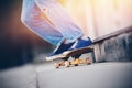 Skateboard man in shoes and jeans getting ready to jump kickflip olli from steps