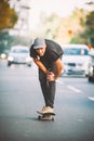 The skateboard rider on the street exhausted of riding skate Royalty Free Stock Photo