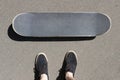 Skateboard and sneakers top view. lifestile concept. Copyspace. Royalty Free Stock Photo