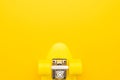 Plastic mini cruiser board on yellow background. bright yellow cruiser skateboard with copy space