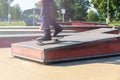 A skateboarder in action doing tricks on ramps at a skate park