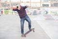 Skateboarder in action in the skate park.