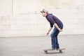 Skateboarder in action in the street. Royalty Free Stock Photo