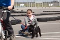 Skateboarder and cyclist with their dog Royalty Free Stock Photo