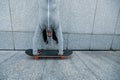 Skateboarder doing a handstand on skateboard against wall Royalty Free Stock Photo