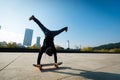 Skateboarder doing a handstand on skateboard