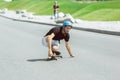 Skateboarder doing a trick at the city`s street in sunny day Royalty Free Stock Photo