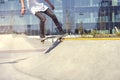 Skateboarder doing a trick in a skate park, practice freestyle extreme sport. Royalty Free Stock Photo