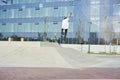 Skateboarder doing a trick in a skate park, practice freestyle extreme sport. Royalty Free Stock Photo