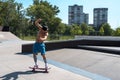 Skateboarder doing tricks on his skateboard during a sunny day Royalty Free Stock Photo