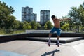 Skateboarder doing tricks on his skateboard during a sunny day Royalty Free Stock Photo