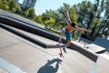 Skateboarder doing tricks on his skateboard during a sunny day Royalty Free Stock Photo