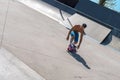 Skateboarder doing tricks on his skateboard during a sunny day Royalty Free Stock Photo