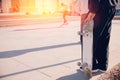 Skateboarder guy is getting ready for trick on skateboard with sunlight Royalty Free Stock Photo
