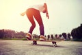 Skateboarder legs doing a track ollie