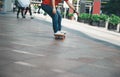 Skateboarder riding skateboard on city street Royalty Free Stock Photo