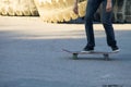 Skateboarder legs riding skateboard at skatepark Royalty Free Stock Photo