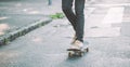 Skateboarder legs riding skateboard on the street Royalty Free Stock Photo