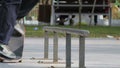 Skater make trick nollie lipslide on rail in skatepark, close-up view slowmotion