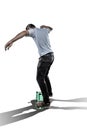 Skateboarder making slide trick isolated on white