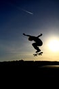 Skateboarder performing an aerial skateboarding jump trick