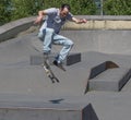 Skateboarder performing a kickflip Royalty Free Stock Photo