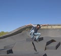 Skateboarder performing a kickflip Royalty Free Stock Photo