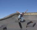 Skateboarder performing a kickflip Royalty Free Stock Photo