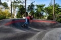 Skateboarder practice on a pump track park Royalty Free Stock Photo