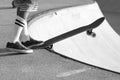 Skateboarder ready to drop a bowl in black and white