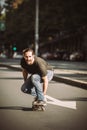 Skateboarder ride a skateboard slope through the city street Royalty Free Stock Photo