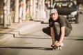 Skateboarder ride a skateboard slope through the city street Royalty Free Stock Photo