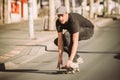 Skateboarder ride a skateboard slope through the city street Royalty Free Stock Photo