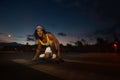 Skateboarder rides skateboard at night Royalty Free Stock Photo