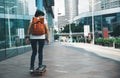 skateboarder riding skateboard on city street Royalty Free Stock Photo