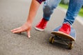 Skateboarder girl riding skateboard through the street Royalty Free Stock Photo