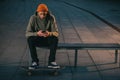 skateboarder sitting on bench
