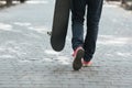 Skateboarder walk at street. City life concept