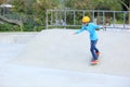 Skateboarders ridng on a skateboard park