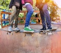 Skateboarders in skatepark