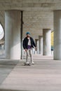 skateboarding boy in the city . Urban architecture. Skate spot. vertical photo Royalty Free Stock Photo