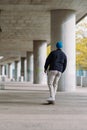 skateboarding boy in the city . Urban architecture. Skate spot. vertical photo Royalty Free Stock Photo