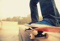 Skateboarding legs riding on a skateboard