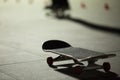 Skateboarding on the skate park with the light from the spotlight  at night Royalty Free Stock Photo