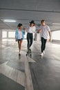 Skateboarding. Young People Having Fun At Parking