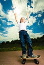 Skater boy child with his skateboard. Outdoor activity. Royalty Free Stock Photo