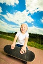 Skater boy child with his skateboard. Outdoor activity. Royalty Free Stock Photo