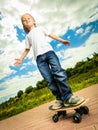 Skater boy child with his skateboard. Outdoor activity. Royalty Free Stock Photo